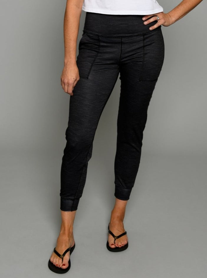 Flip Outfit Reversible Women’s Joggers, Pants - solid black reverses to grey.  Mid-rise sweat-wicking UPF 50. Made in the USA from recycled plastic bottles. Made by women for women. Front view of black side.
